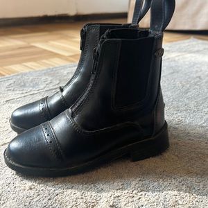 Little girl all black riding boots